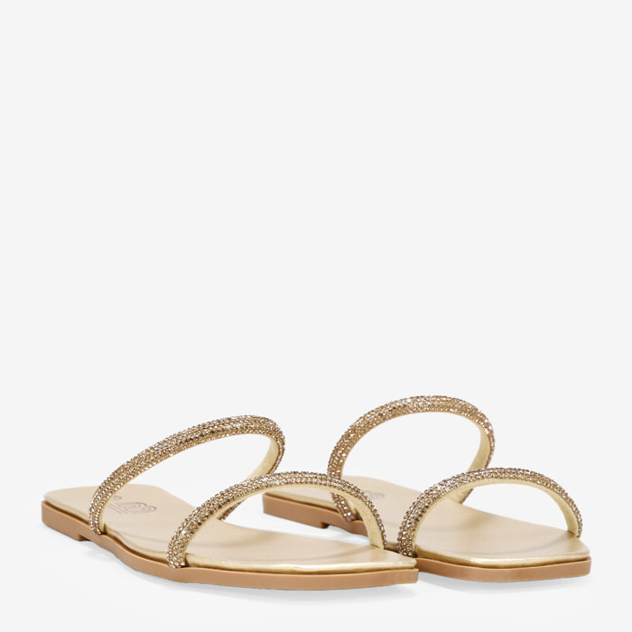 Sandalias planas doradas con dos tiras brillantes