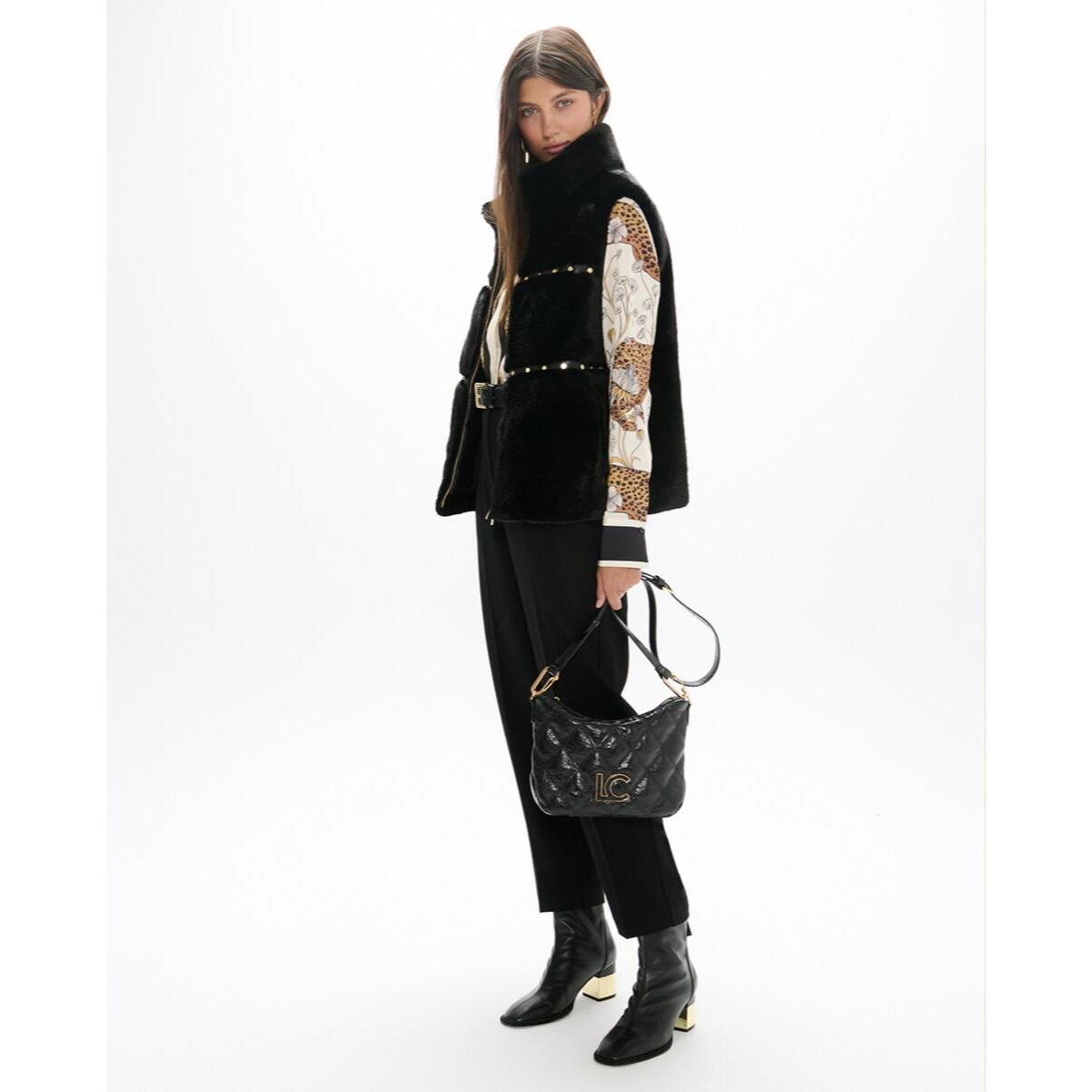Gilet con dettagli metallici