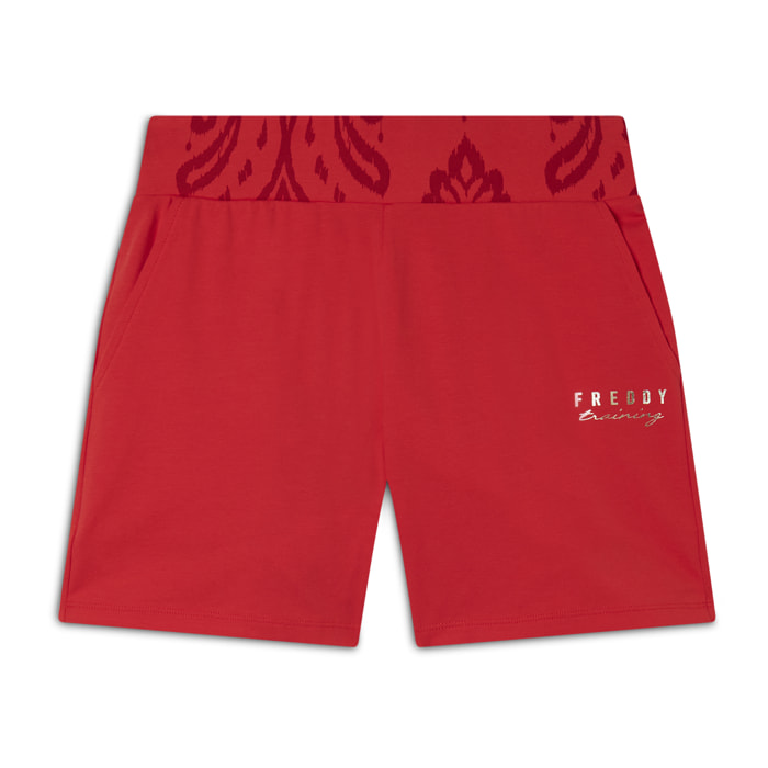 Short sportivi con fascia in vita floreale