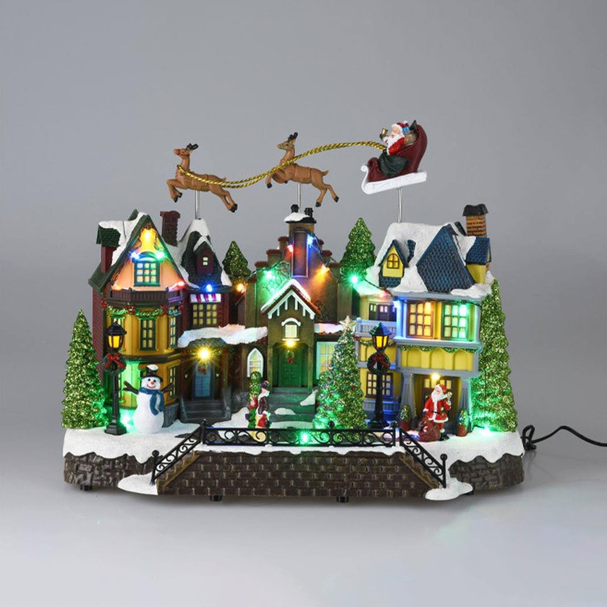 Casa navideña village con 24 luces led multicolor con sonido