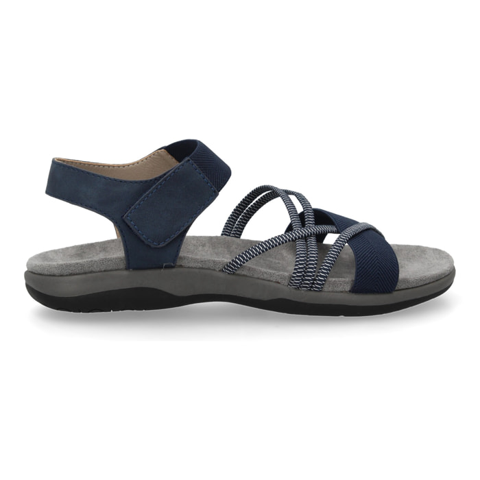 Sandalias planas de mujer diseño moderno, comodas con cierre de cierre autoadherente y con tiras elasticas cruzadas