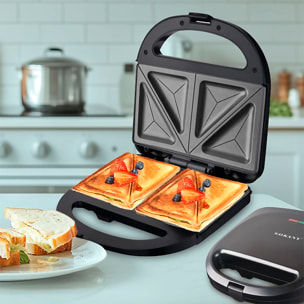 Sandwichera antiadherente con 750W de potencia y luz indicadora. Placas triangulares especiales sandwich.