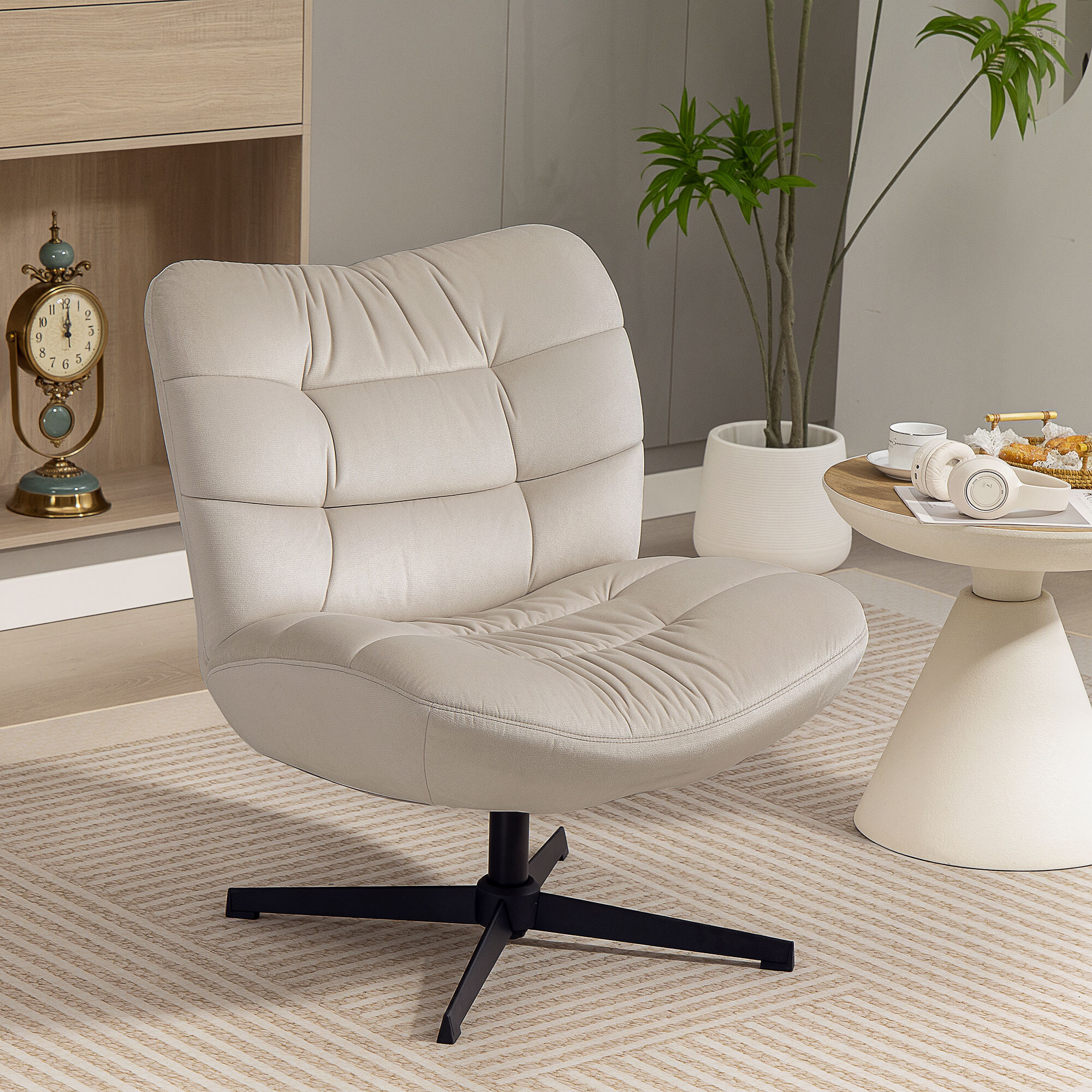 Fauteuil lounge effet matelassé grand confort pivotant piètement acier croisé noir tissu chenille grège