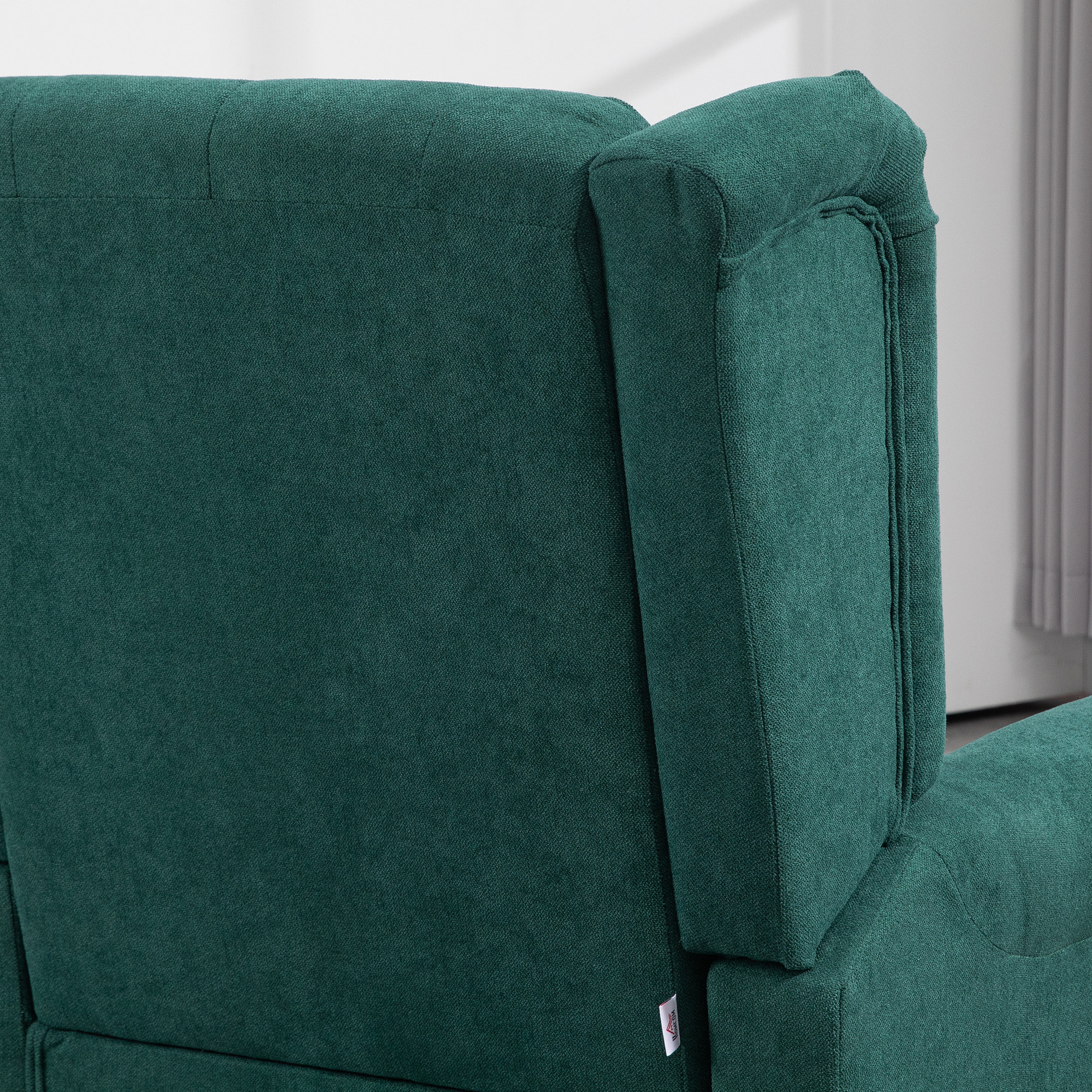 Fauteuil à oreilles style Chesterfield dossier capitonné grand confort bois noir tissu vert