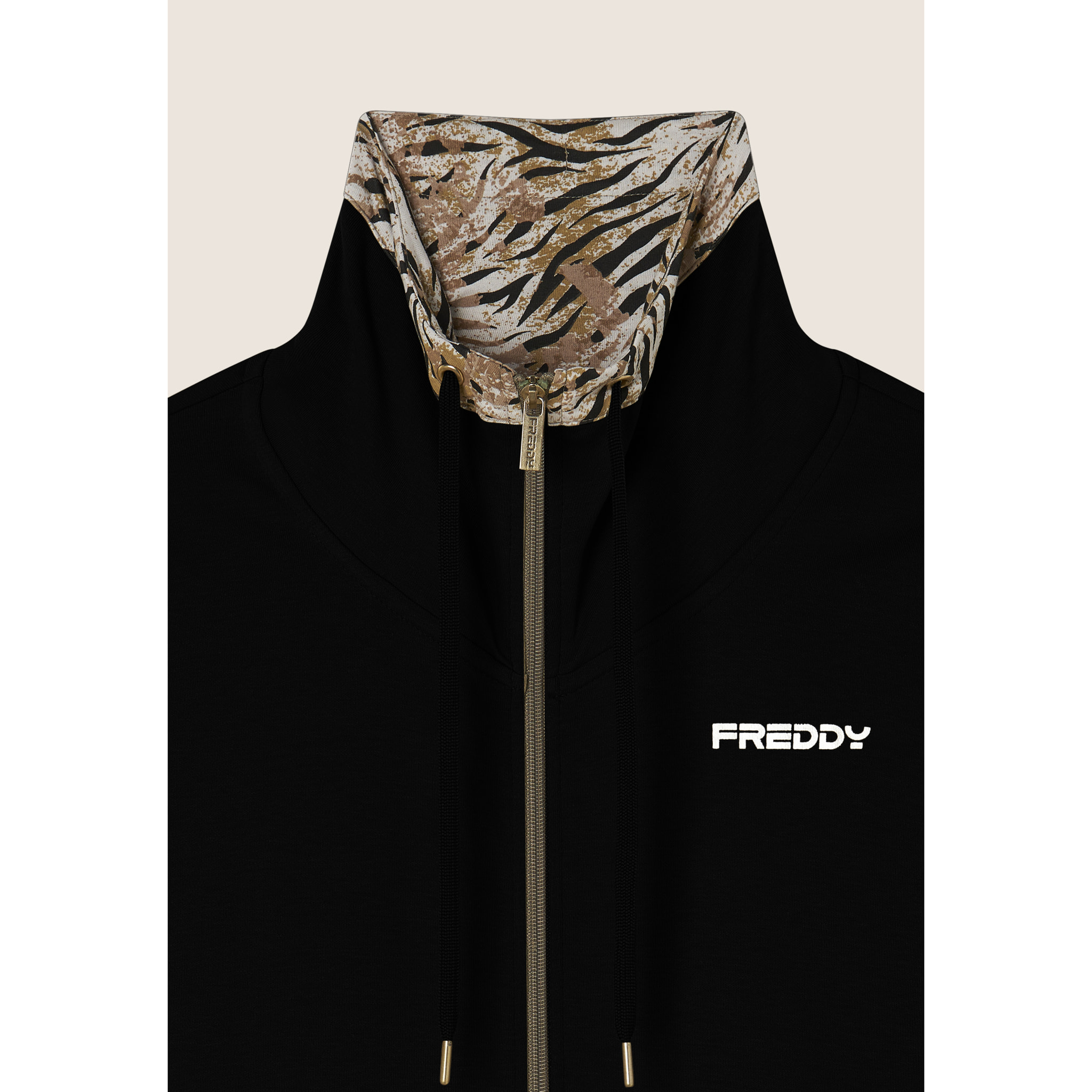 Tuta interlock con zip e collo alto interno fantasia