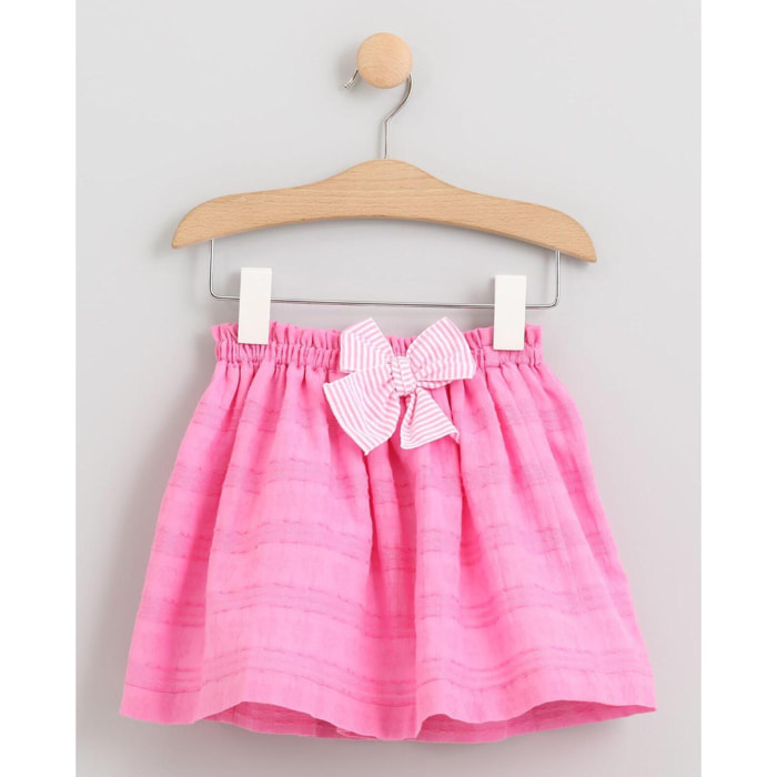 FALDA VOILE ROSA CON LAZO SEERSUCKER