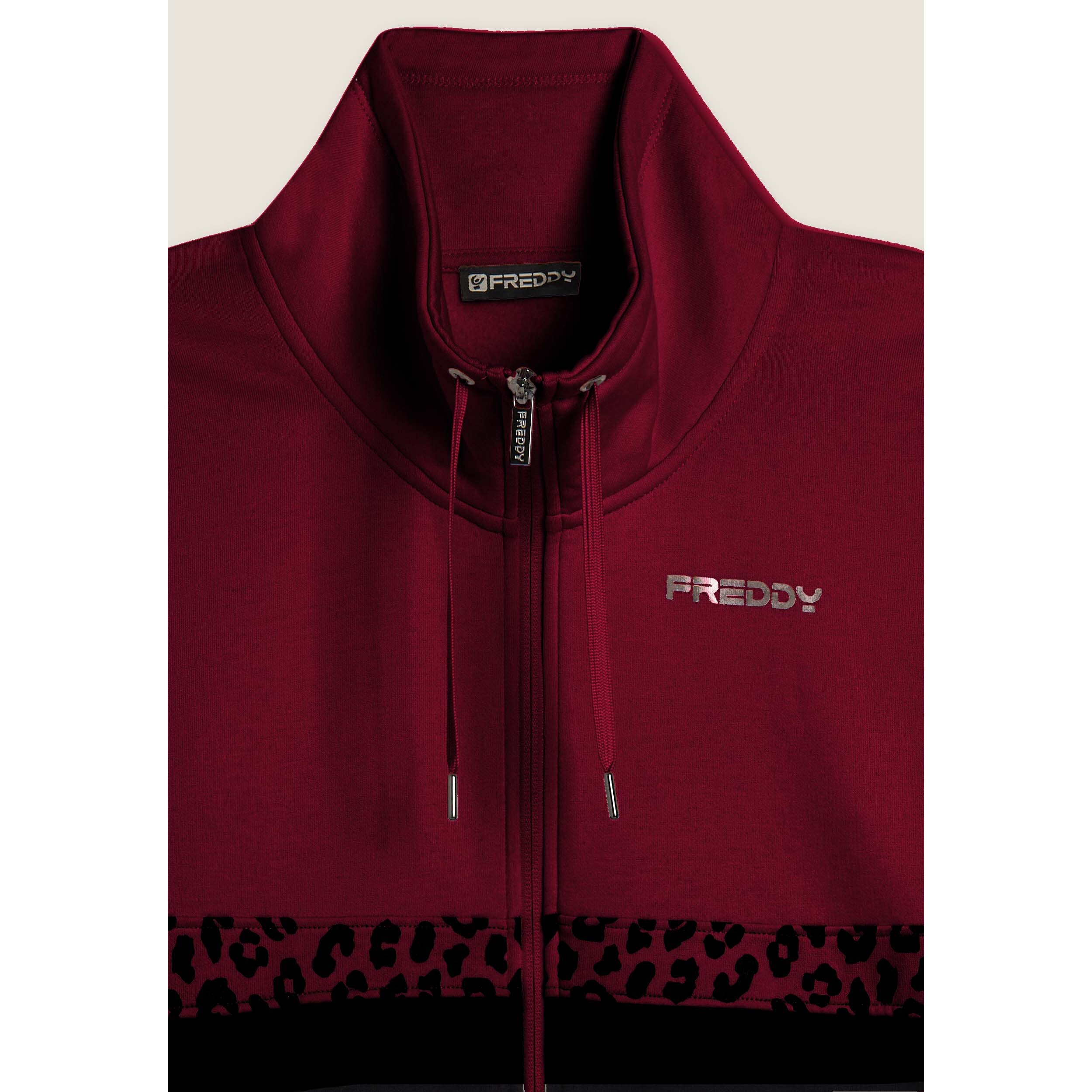 Tuta con zip e collo alto decorata da inserti animalier