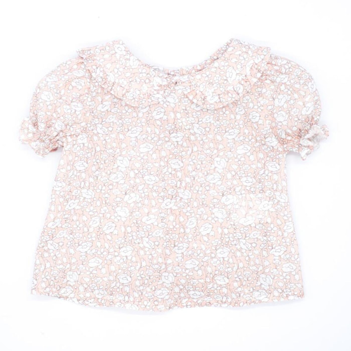 Blusa estampado de flores rosas, con manga abullonada y cuello.