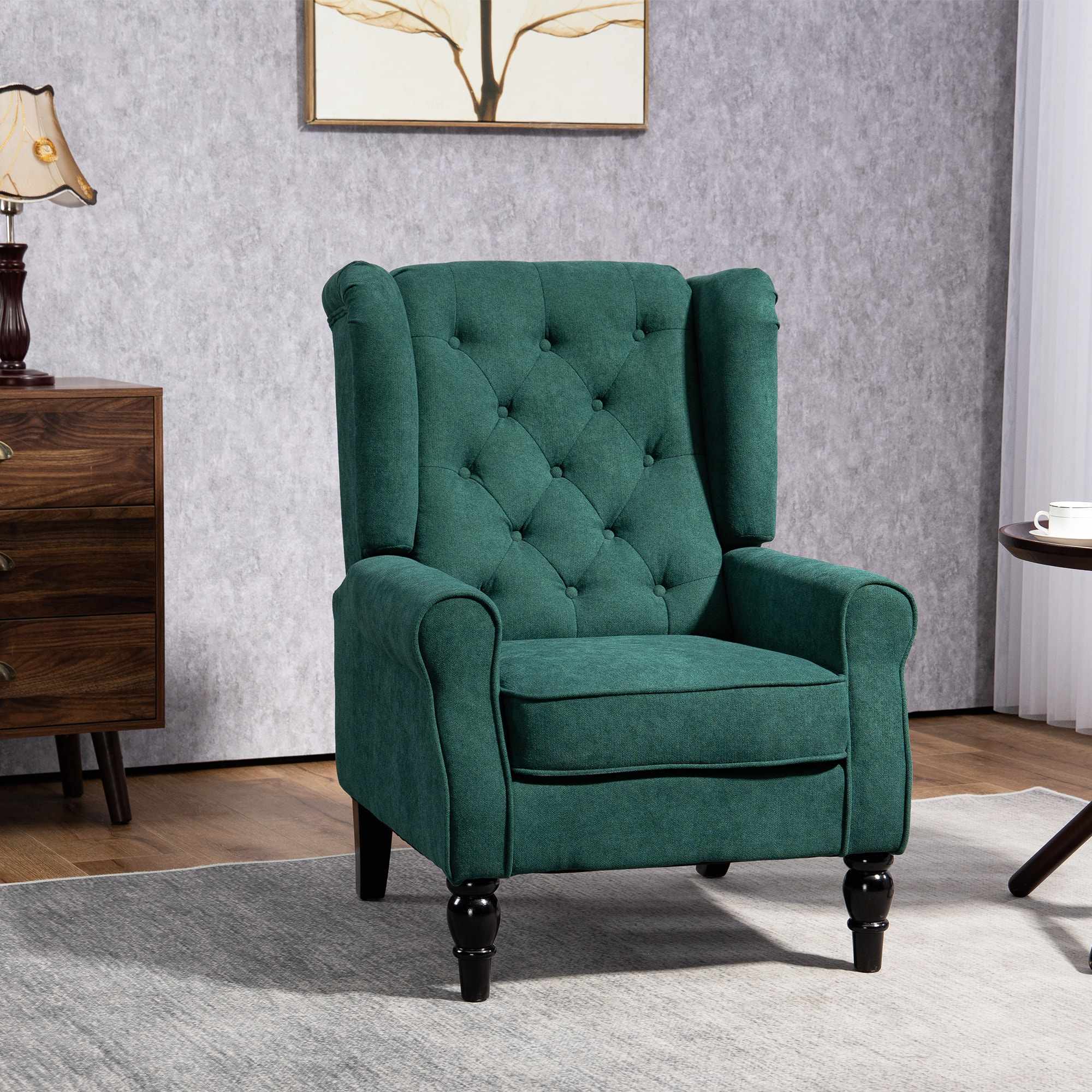 Fauteuil à oreilles style Chesterfield dossier capitonné grand confort bois noir tissu vert