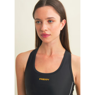 Top tecnico con spalline incrociate e profili bianchi