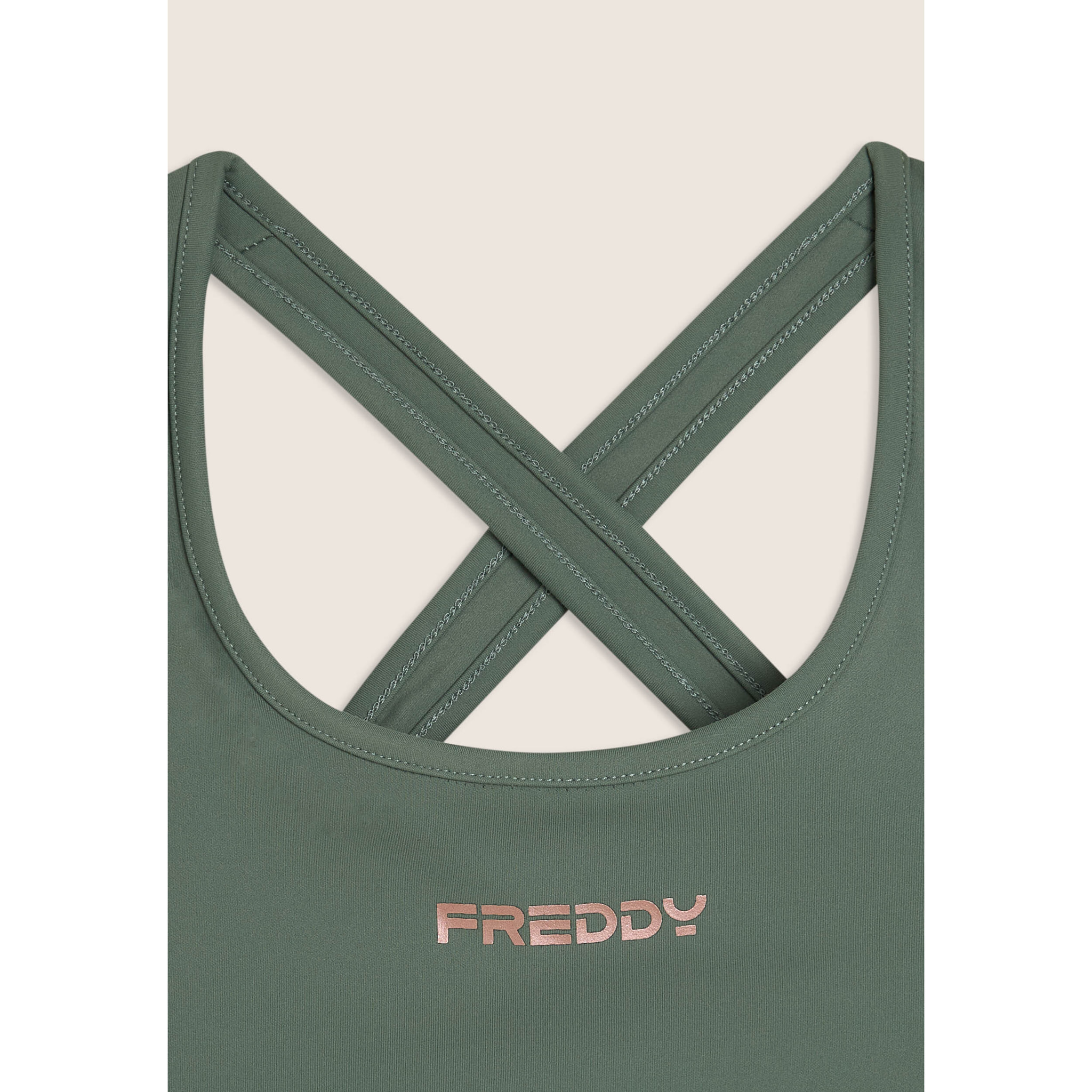 Top medio supporto in jersey tecnico con spalline incrociate