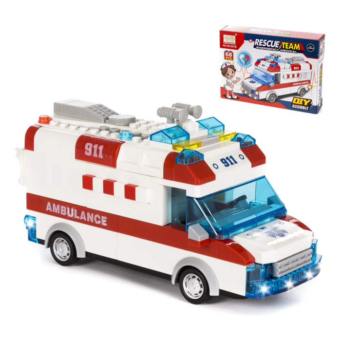 Ambulanza con luci ed effetti sonori. Da costruire, 68 pezzi. Funzionamento per inerzia di ritorno.