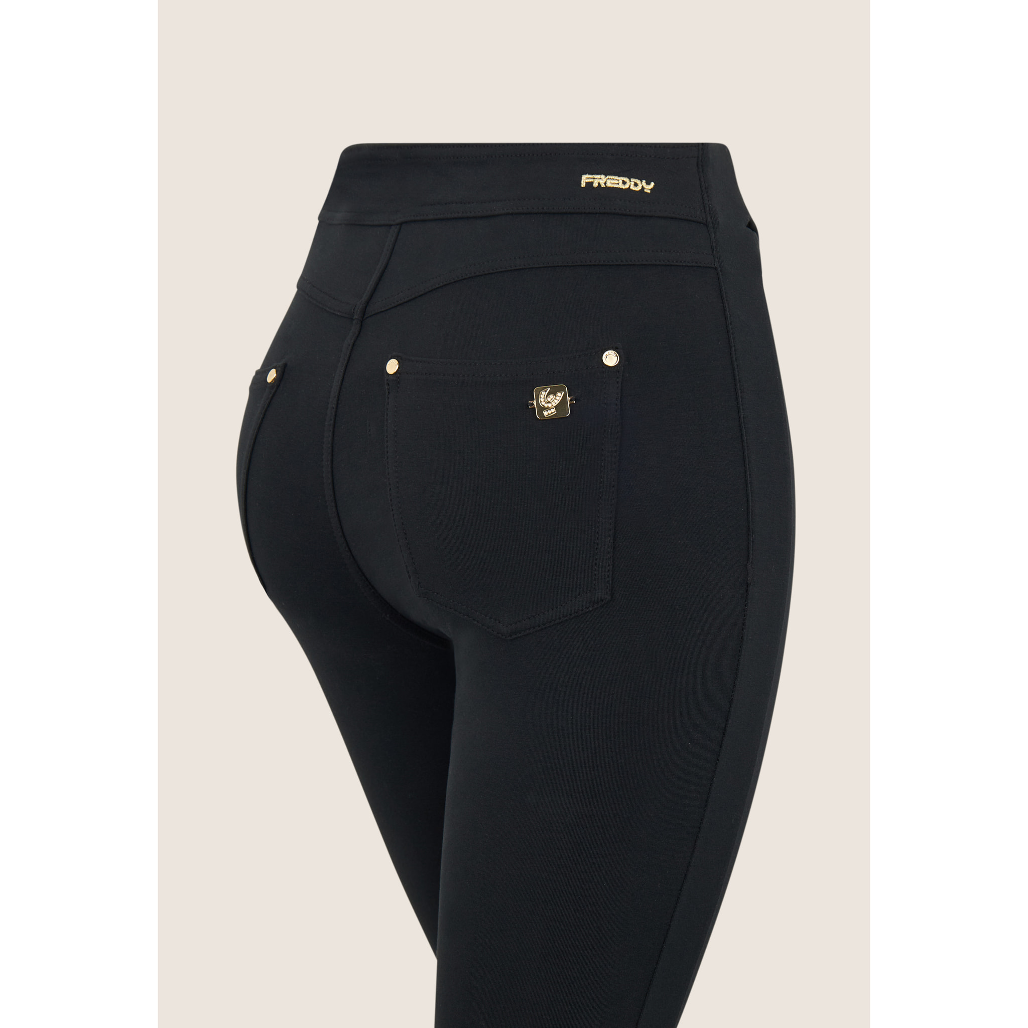 Pantaloni super skinny vita alta bande incrociate