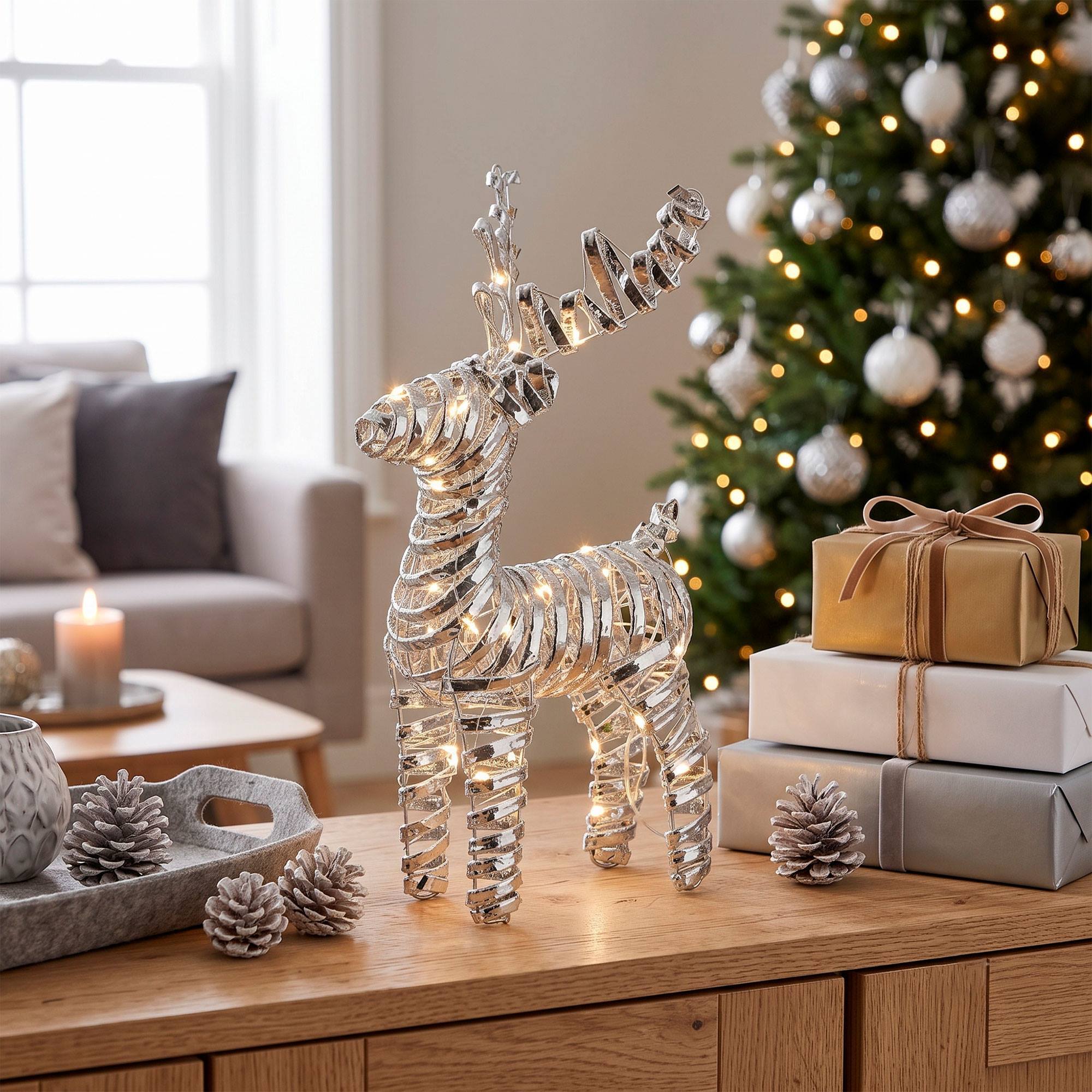 Reno navideño led plateado con 25 microled blanco cálido, con temporizador 20x7x34 cm