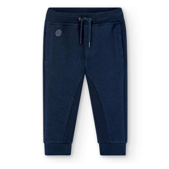 Pantalón deportivo en azul con cintura elástica y bolsillos