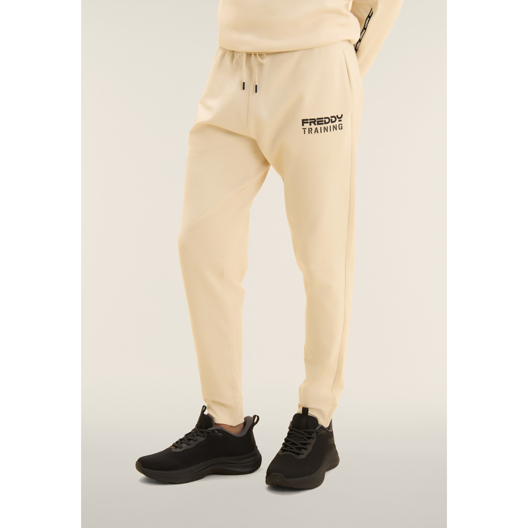 Pantaloni slim cropped con fondo in costina