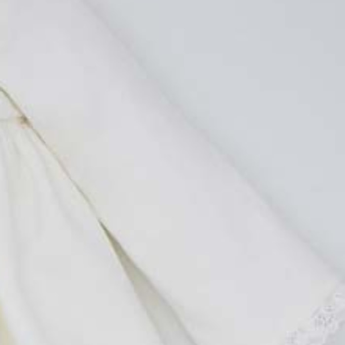 FALDÓN PIQUÉ CON LAZOS BLANCO