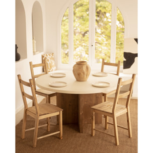 Mesa de comedor redonda de microcemento en tono blanco roto con patas de madera tono roble oscuro en varias medidas