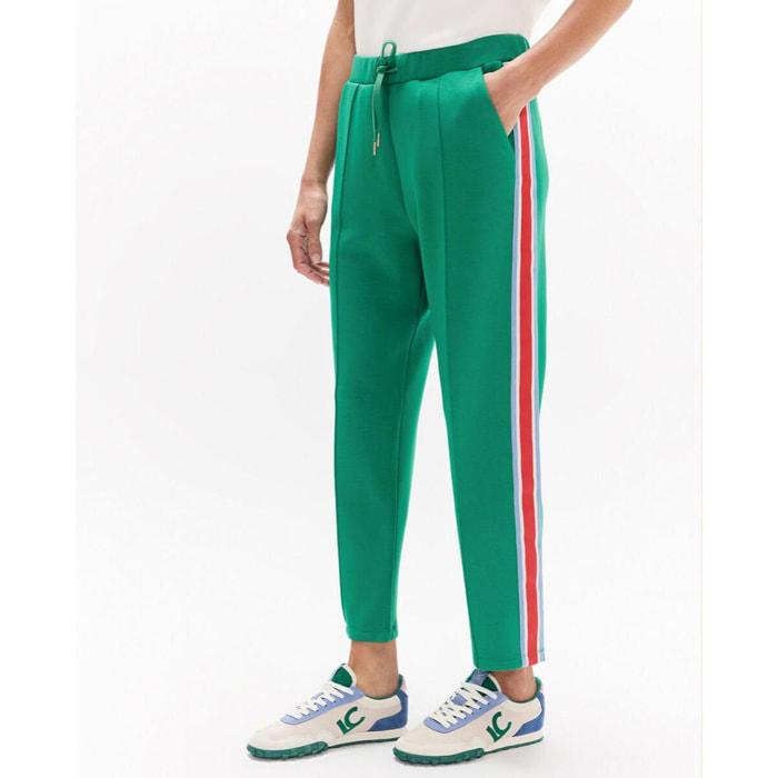 Pantaloni da jogging con striscia laterale tricolore, coulisse regolabile e dettagli metallici.