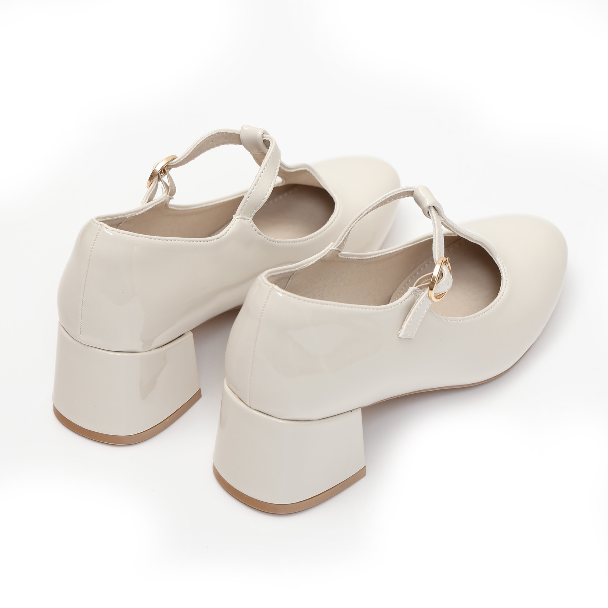 Dècolletè in simil pelle verniciata con tacco basso quadrato