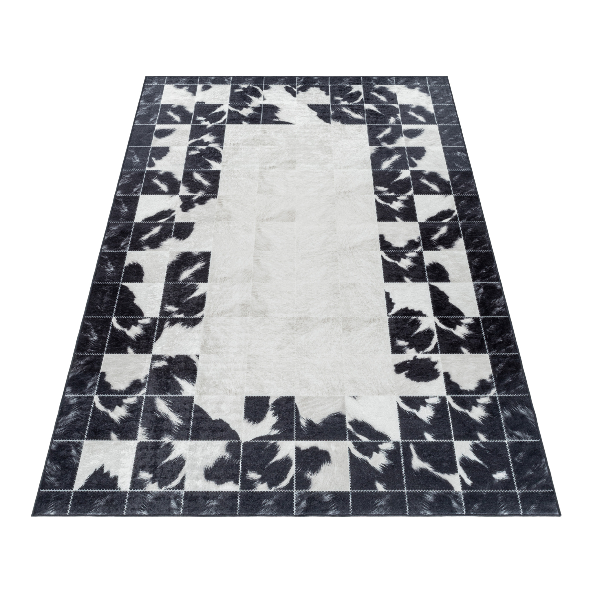 FIESTA - Tapis patchwork imitation peau noir et blanc