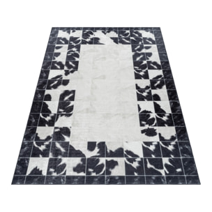 FIESTA - Tapis patchwork imitation peau noir et blanc