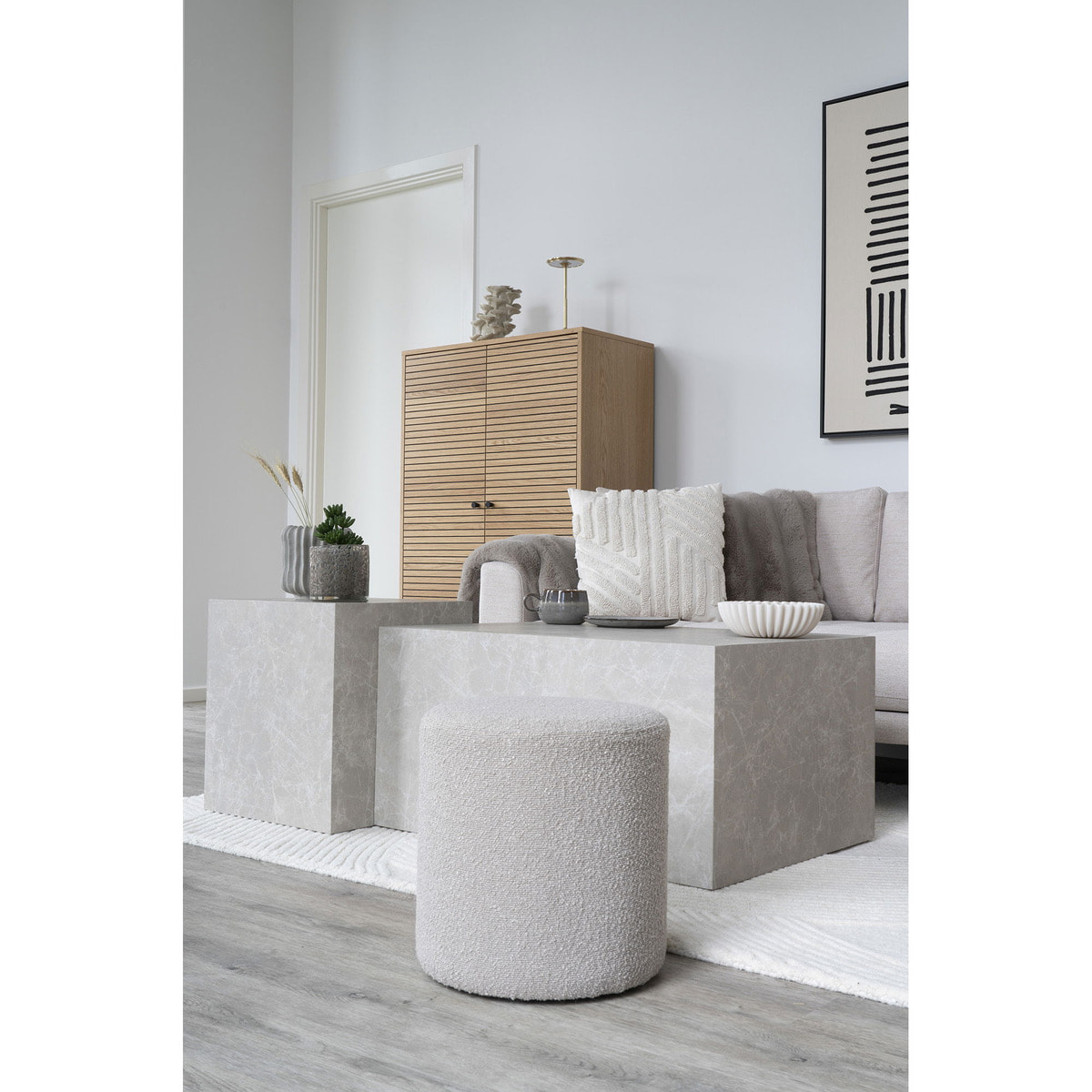 Pouf Ejby rotondo in bouclé beige ø34 cm