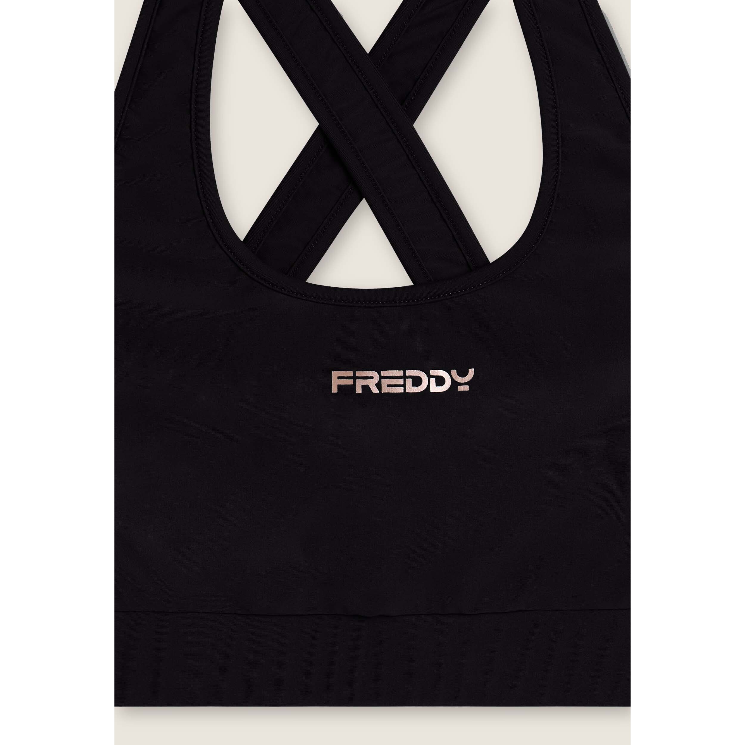 Top tecnico con spalline incrociate e profili bianchi