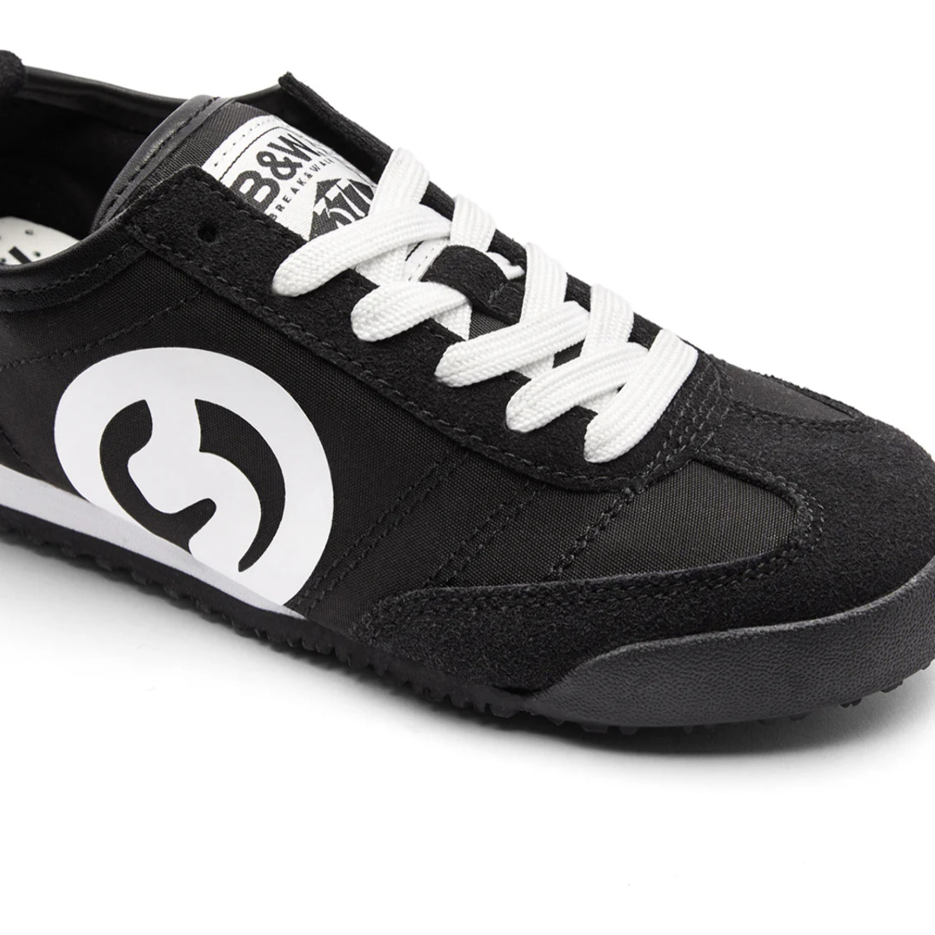 Sneakers nere con dettagli in pelle scamosciata