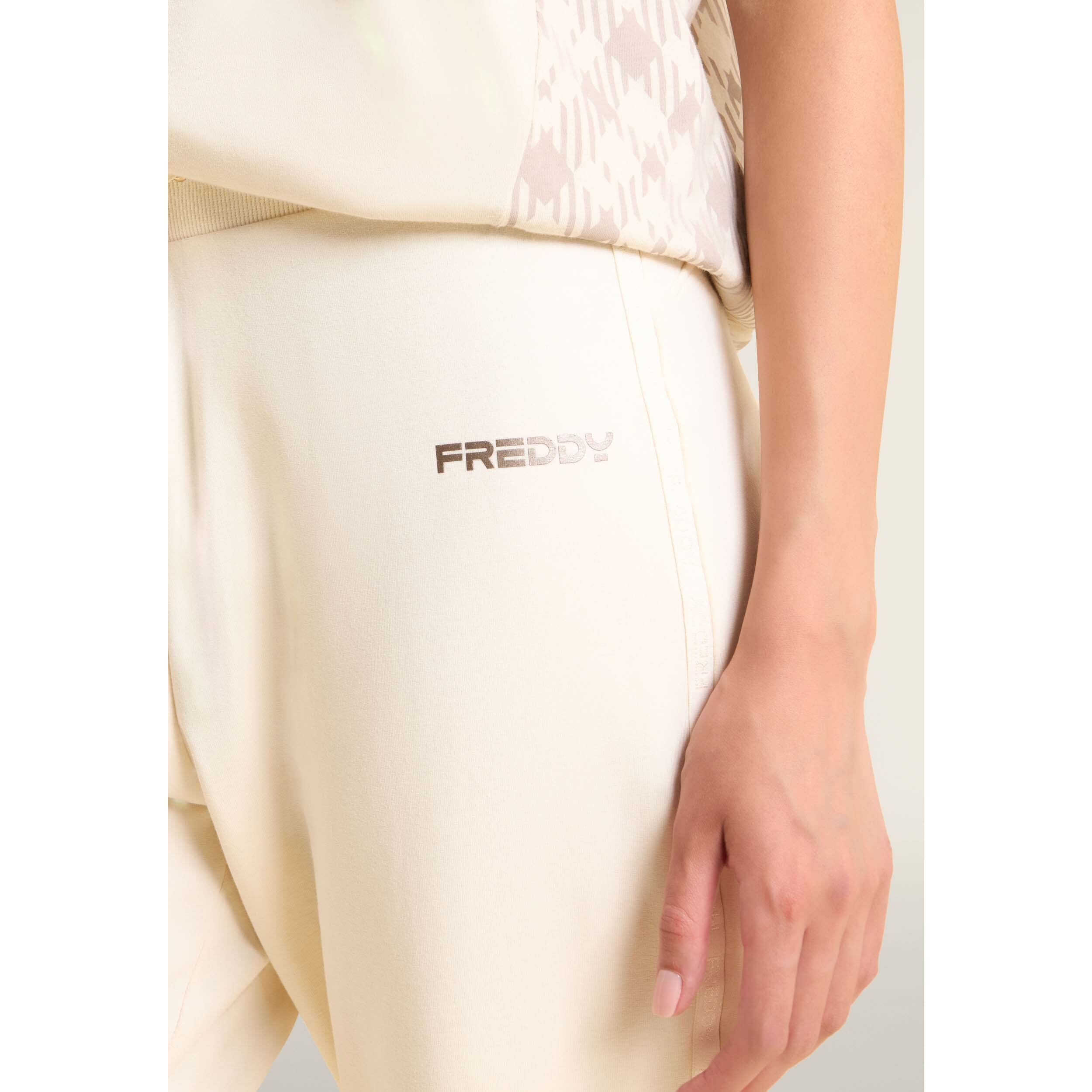 Pantaloni con fondo a costina e bande logate