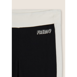 Pantaloni slim flare in felpa con bande laterali