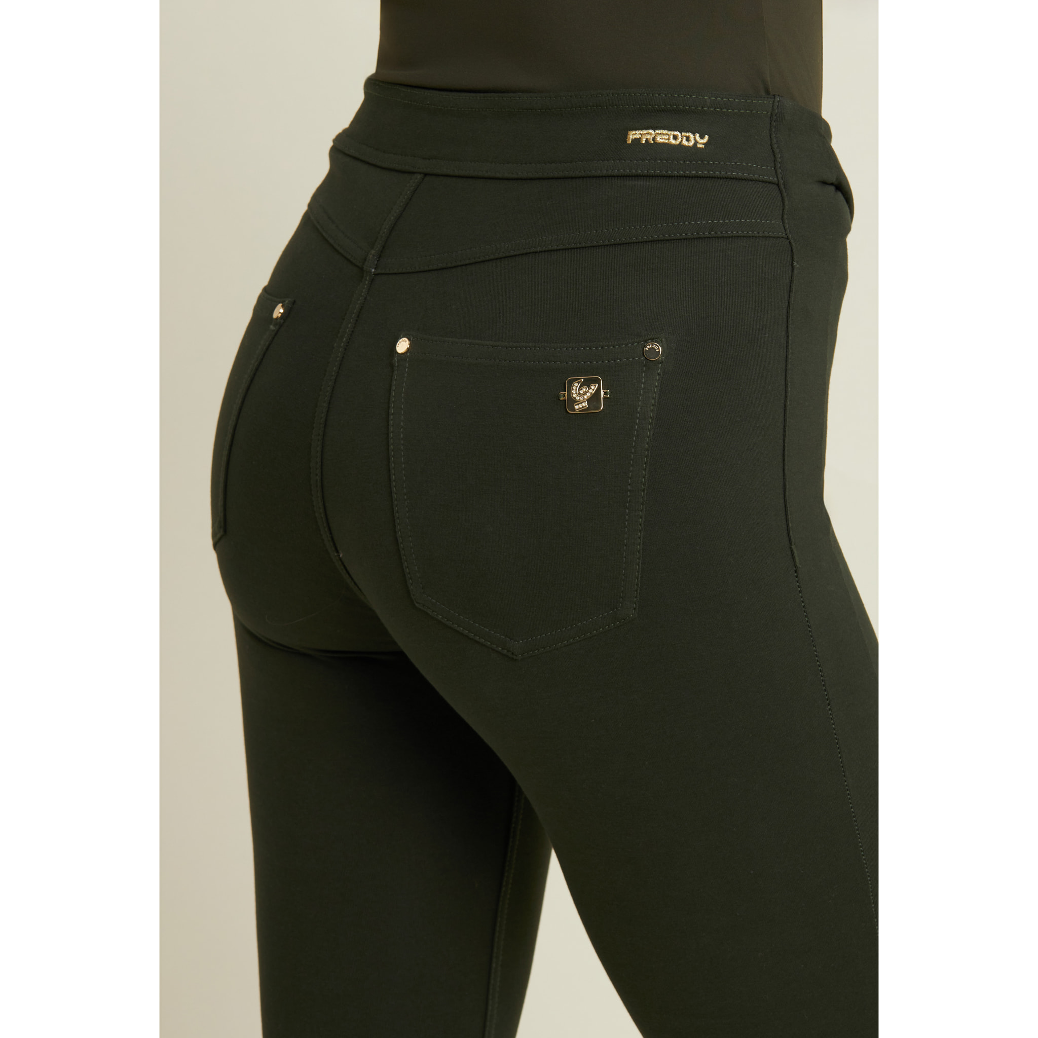 Pantaloni super skinny vita alta bande incrociate