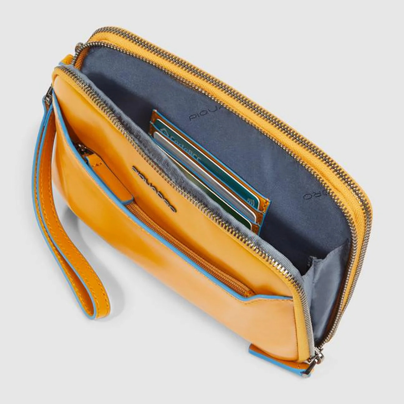 Piquadro Pochette in pelle con polsiera rimovibile e protezione RFID