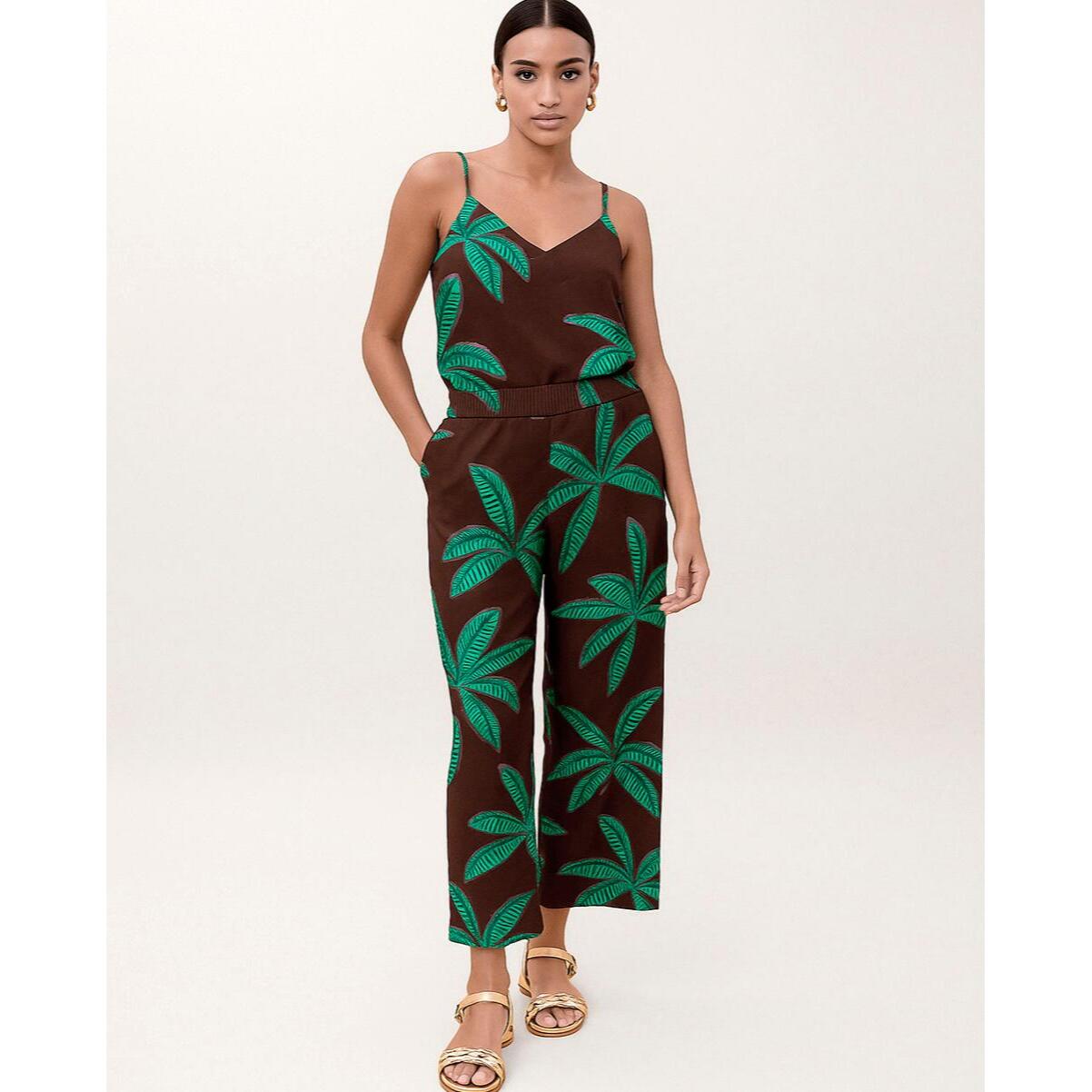 Pantaloni con sfondo marrone e palme