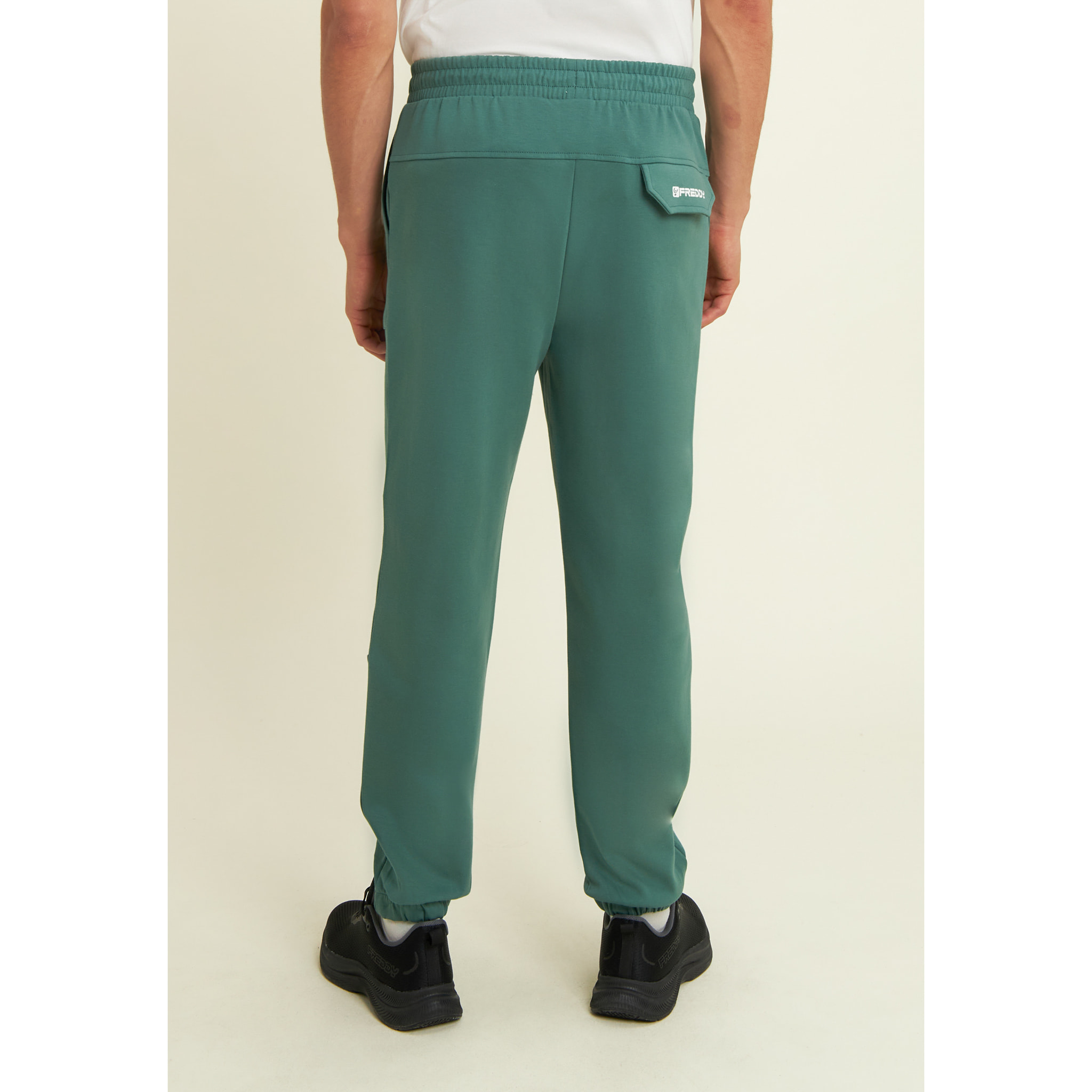 Pantaloni slim in interlock con stampa UT e cuciture