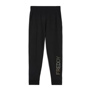 Pantaloni in french terry modal con logo borchiato sul fondo