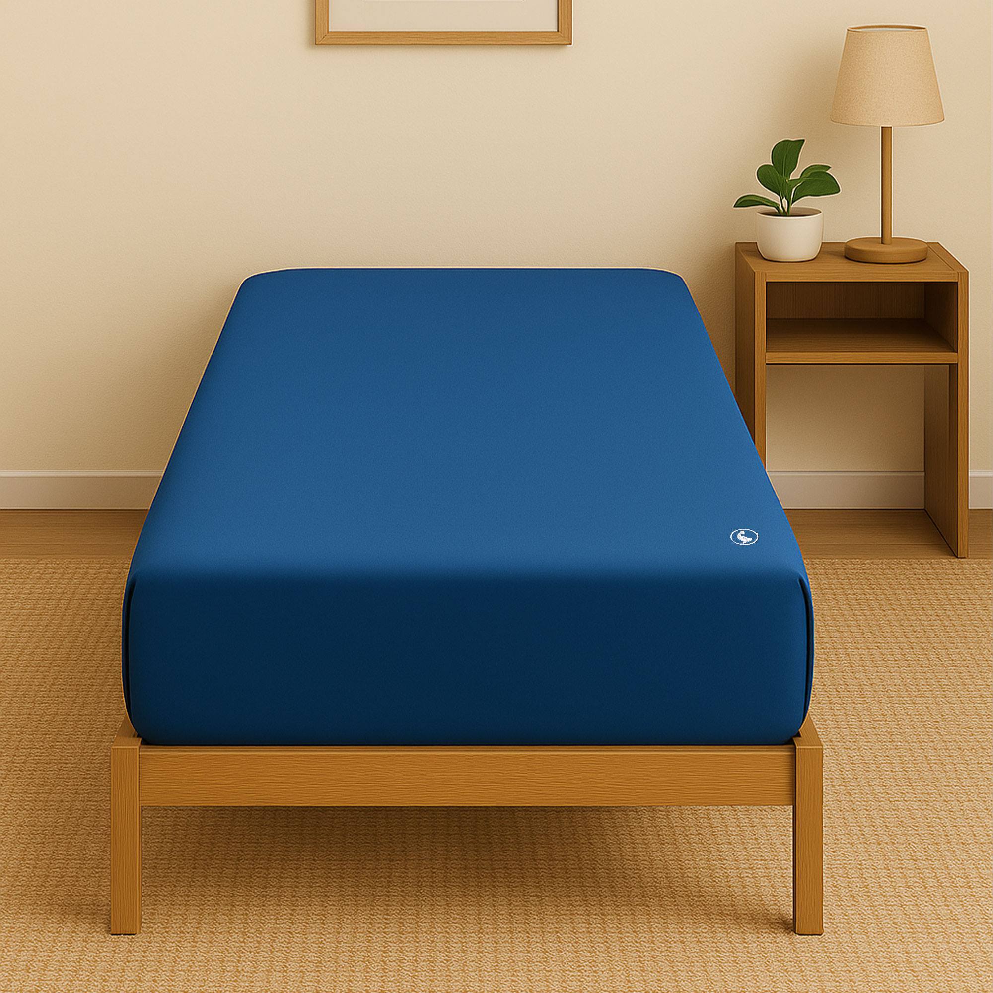 Sábana bajera (90x200+30cm solapa) 100%algodón 180tc color azul marino logo bordado el ganso