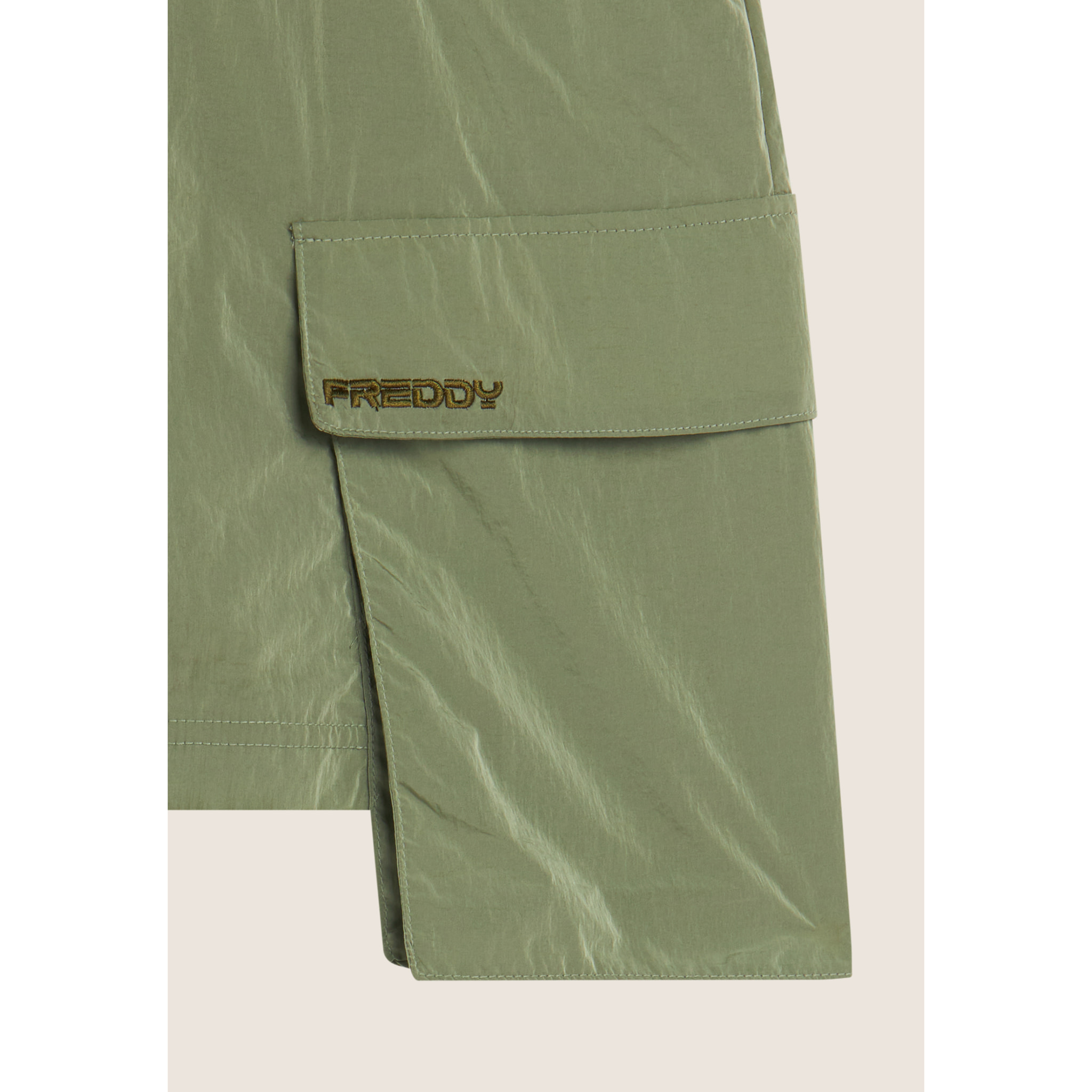 Gonna corta in nylon navetta con tasconi