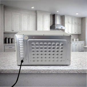 Horno eléctrico de sobremesa con 25 litros de capacidad. Panel de control mecánico y 1300 W de potencia.