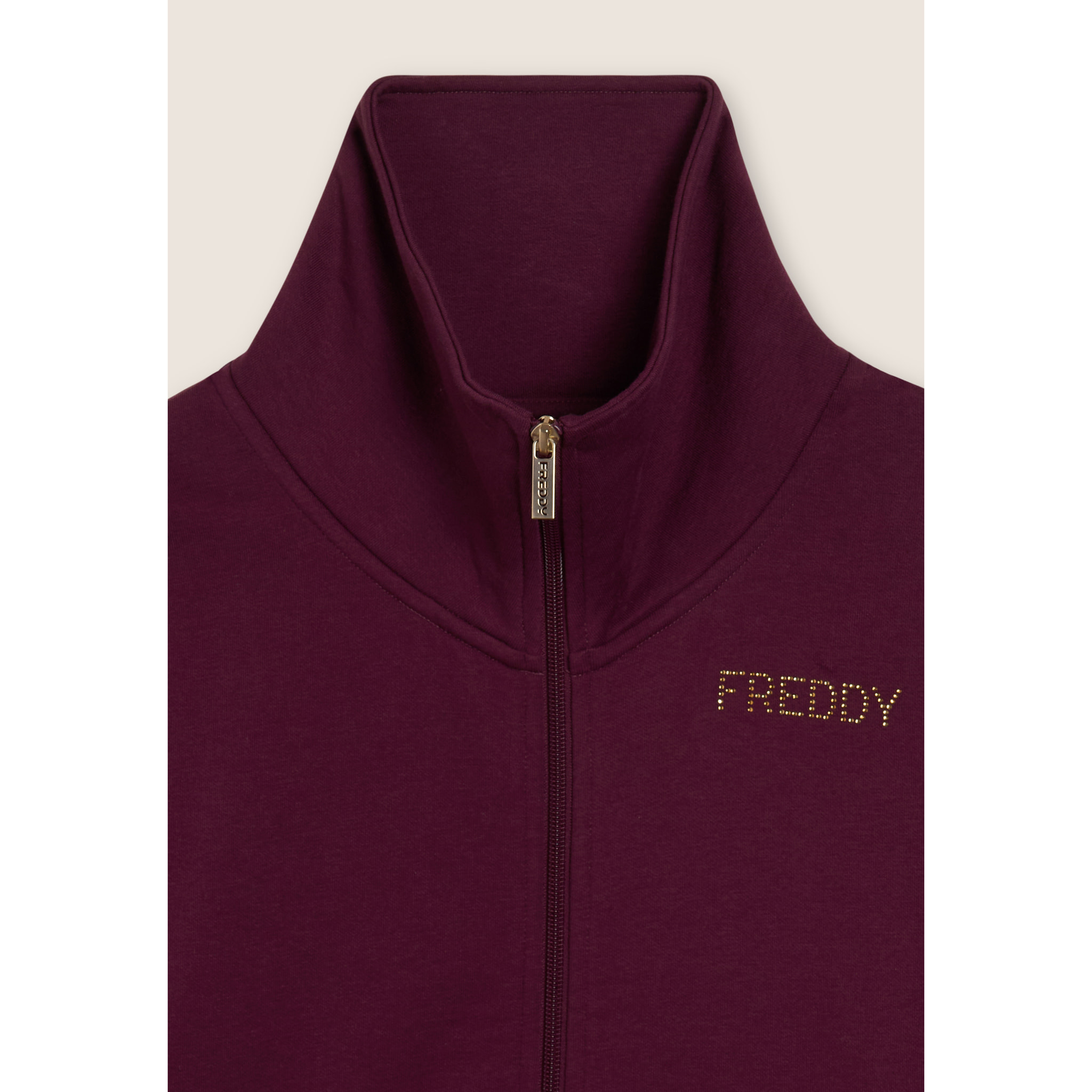 Tuta sportiva collo alto con scritta in strass