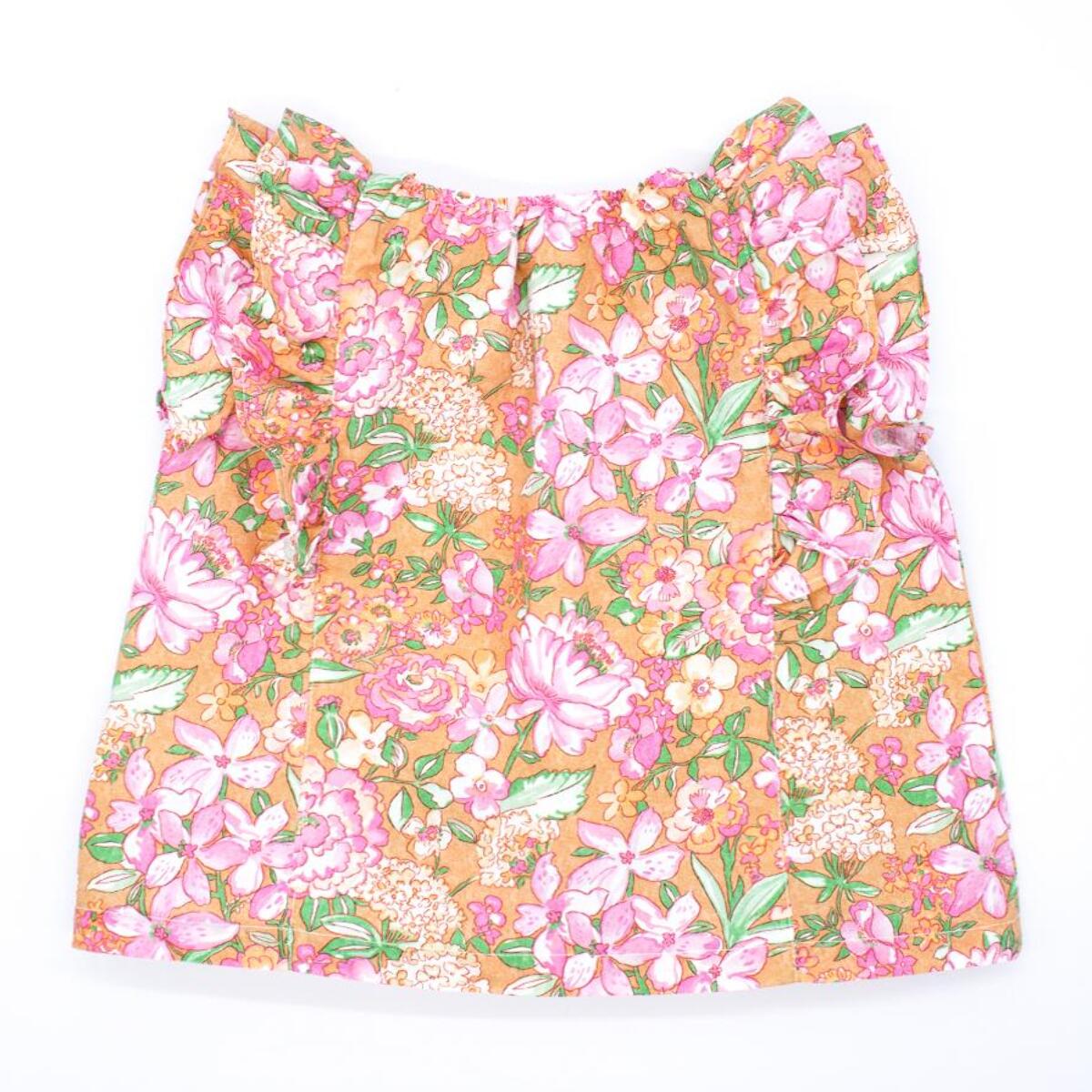 Blusa ocre flor rosa