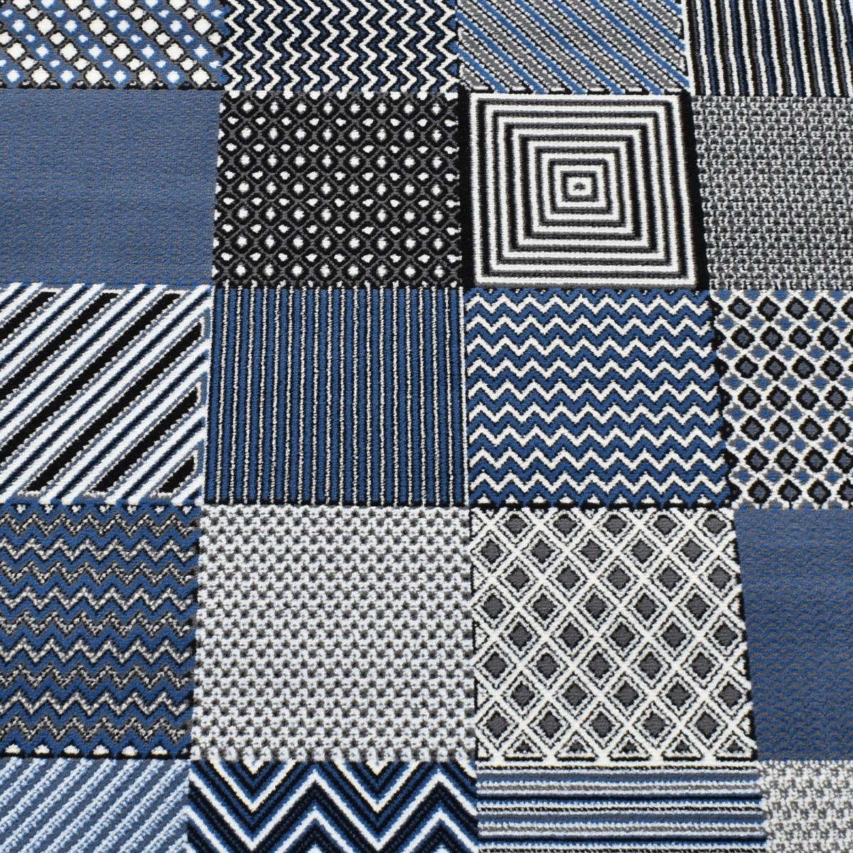 Tapis Dufi motif géométrique différentes teintes de bleu
