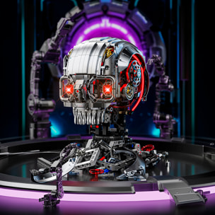 Maqueta 3D mecanizada de calabera con 1099 piezas, equipada con luces y mecanismo de manivela que permite movimiento dinámico.