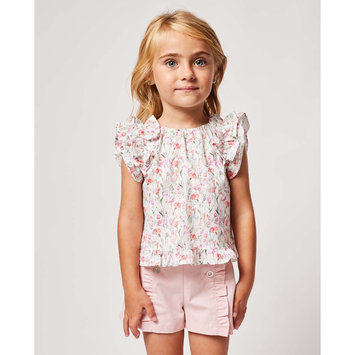 BLUSA CON VOLANTES ESTAMPADA FLORES ROSA