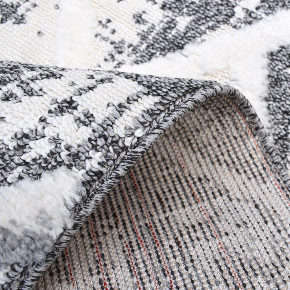 Tapis Gaco en relief dessin géométrique, couleur gris et blanc