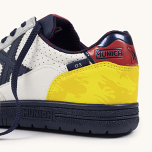 Zapatilla de Fútbol Sala Infantil Blanca con Detalles Amarillo y Azul MUNICH G-3 KID 451
