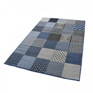 Tapis Dufi motif géométrique différentes teintes de bleu