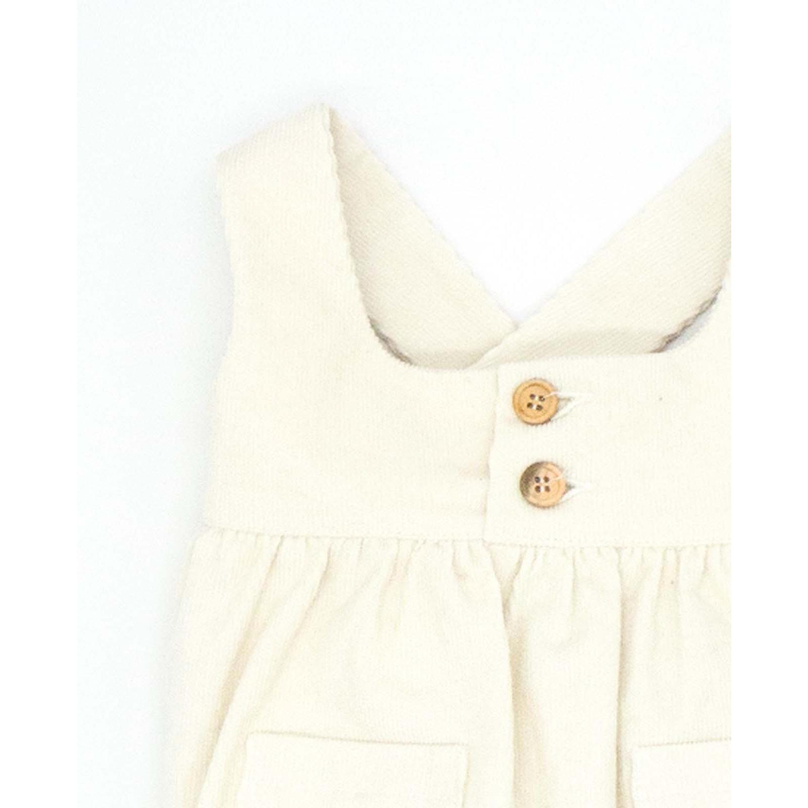 Peto con gomitas y botones pana blanco