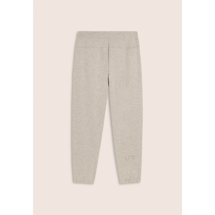 Pantaloni slim mélange con stampa trasparente e zip