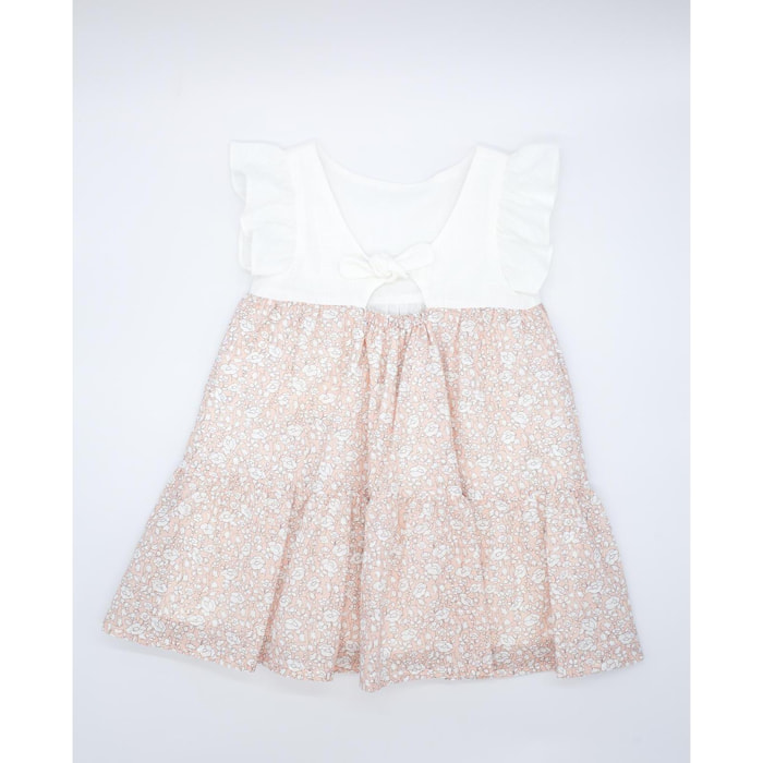 Vestido con el cuerpo en blanco y falda estampada de flores albaricoque. Con volantes en las sisas, falda fruncida de volantes.